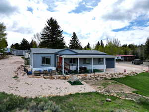 Ranch-style house featuring covered porch