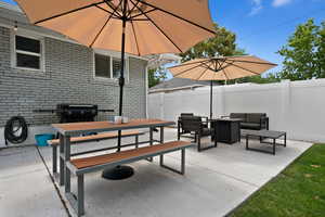 View of patio featuring fence, outdoor lounge area, area for grilling, and outdoor dining space