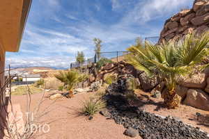 View of xeriscape yard with waterfall