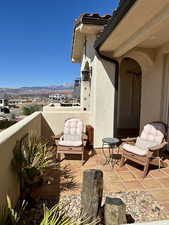 View of courtyard patio featuring sitting area and a mountain view