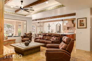 Living area featuring beam ceiling, recessed lighting, a tiled ceiling, and a ceiling fan