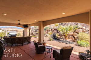 View of patio featuring outdoor lounge area and ceiling fan