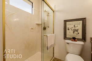 3/4 Casita bathroom with a shower stall and toilet