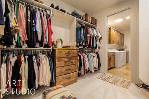 Spacious Primary bedroom closet with access to laundry room