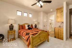 Casita Bedroom #3 featuring a ceiling fan, kitchenette, ensuite bathroom, and light carpet