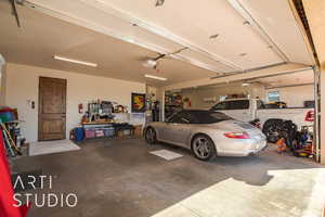 4 car Garage featuring a garage door opener