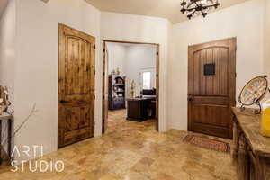 Foyer featuring stone finish flooring