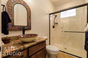 3/4 bathroom with a shower stall, toilet, and vanity, ensuite bedroom #4