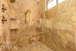 Interior details featuring tiled shower with dual shower heads