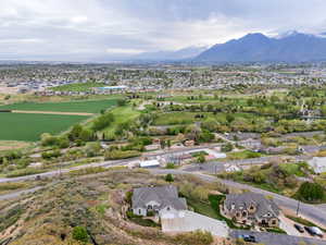 Birds eye view of property with a residential view and a mountain view