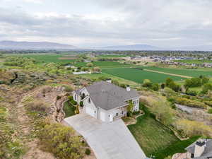 Birds eye view of property featuring a mountain view and a rural view