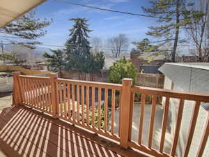 Wooden deck featuring fence