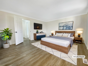 Bedroom with visible vents, light wood-style flooring, crown molding, and baseboards