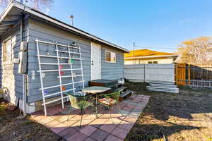 Exterior space with a patio and fence