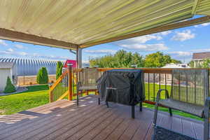 Wooden deck featuring a yard