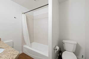 Bathroom featuring shower / bath combo and vanity