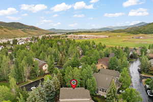 Aerial view of residential area featuring mountains