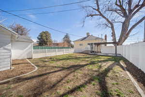 View of yard with a patio, a fenced backyard, and a pergola