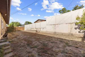 View of fenced backyard