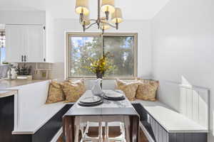 Dining space featuring breakfast area and a chandelier