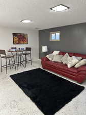 Living room featuring a textured ceiling
