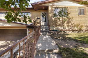 Entrance to property with brick siding