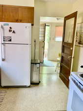 Kitchen featuring white appliances