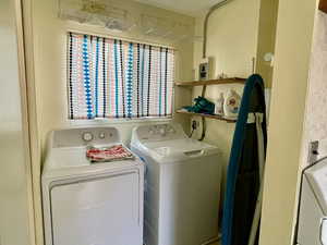 Laundry area featuring separate washer and dryer