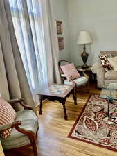 Living area with hardwood / wood-style floors