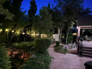 Yard at twilight featuring a deck