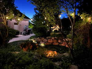 View of yard with fire pit area