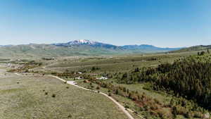 Birds eye view of property with a mountain view