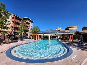 View of swimming pool featuring a gazebo and fence