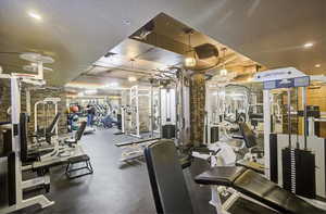 Gym featuring a textured ceiling