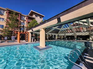 Pool featuring a patio area and fence