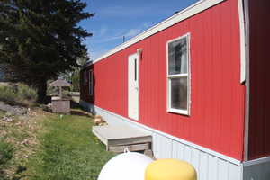 View of home's exterior with a yard