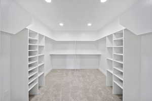 Spacious closet with carpet floors