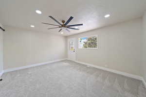 Unfurnished room featuring recessed lighting, baseboards, light carpet, and ceiling fan