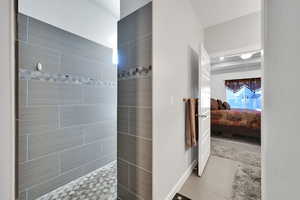 Ensuite bathroom with tile patterned floors, ensuite bathroom, and walk in shower