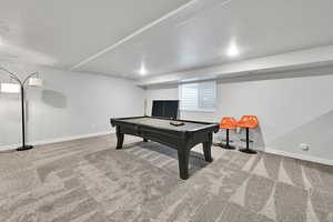 Rec room featuring billiards, baseboards, and carpet floors