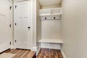 Mudroom with storage and wood floors, access is available to both the main floor and the In-Law apartment.