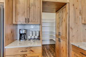 Hidden Pantry Door leading into a large walk in pantry.