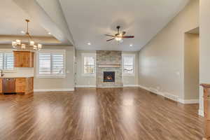 Main floor living room with a wealth of natural light and wood flooring.