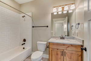 Secondary Bathroom with vanity, toilet, bathtub / shower combination.