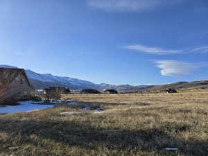 Property view of mountains with a rural view