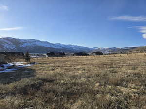 Property view of mountains with a rural view