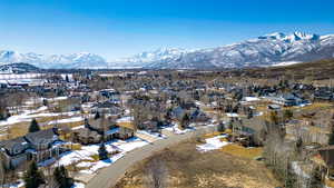 Birds eye view of property with a mountain view and a residential view