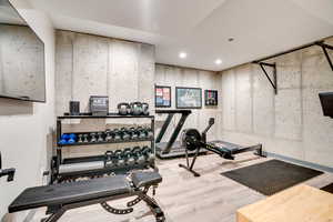 Workout area featuring recessed lighting and wood finished floors