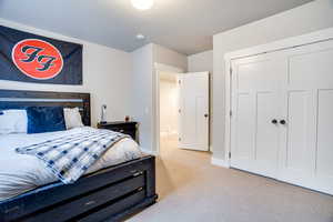 Bedroom with baseboards and carpet