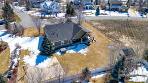 Snowy aerial view with a residential view